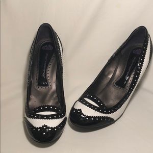 Black and white patent spectator pumps